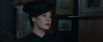 Movie still from “Their Finest” (2016), directed by Lone Scherfig – A person wearing a hat; Close Up shot, Low angle