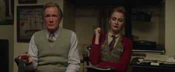 Movie still from “Their Finest” (2016), directed by Lone Scherfig – A man and a woman sitting next to each other; Medium shot, Low angle