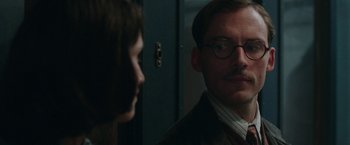 Movie still from “Their Finest” (2016), directed by Lone Scherfig – A man and a woman are looking at each other; Close Up shot, Over the shoulder angle