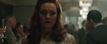 Movie still from “Their Finest” (2016), directed by Lone Scherfig – A person with long red hair; Close Up shot, Over the shoulder angle
