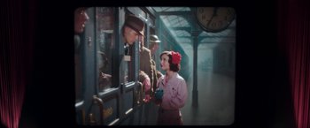 Movie still from “Their Finest” (2016), directed by Lone Scherfig – A man and a woman looking out of a train window; Wide shot, Over the shoulder angle