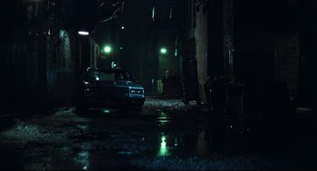 Movie still from “Thief” (1981), directed by Michael Mann – A car parked in the middle of the street at night; Extreme Wide shot, Low angle