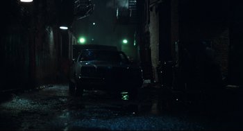 Movie still from “Thief” (1981), directed by Michael Mann – A car parked in the middle of the street at night; Wide shot, Low angle