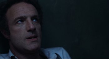 Movie still from “Thief” (1981), directed by Michael Mann – A person looking up at the sky; Close Up shot, High angle