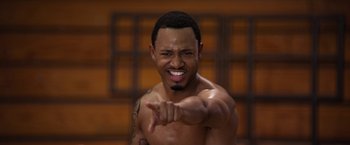 Movie still from “Think Like a Man” (2012), directed by Tim Story – A shirtless man pointing his finger at the camera; Close Up shot, High angle