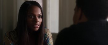 Movie still from “Think Like a Man” (2012), directed by Tim Story – A woman sitting in front of a man in front of a window; Close Up shot, Over the shoulder angle