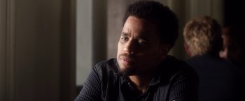 Movie still from “Think Like a Man” (2012), directed by Tim Story – A person sitting in a room; Close Up shot, Over the shoulder angle