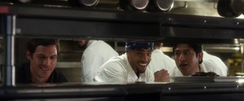 Movie still from “Think Like a Man” (2012), directed by Tim Story – A man in a chef's hat looking through a window; Close Up shot, High angle
