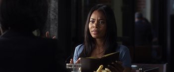 Movie still from “Think Like a Man” (2012), directed by Tim Story – A woman sitting at a table with food in front of her; Close Up shot, Over the shoulder angle