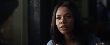 Movie still from “Think Like a Man” (2012), directed by Tim Story – A person with long black hair; Close Up shot, Over the shoulder angle