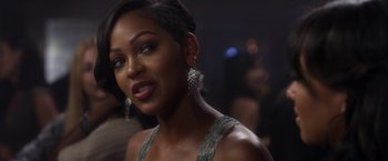 Movie still from “Think Like a Man” (2012), directed by Tim Story – A woman that is posing for a picture; Close Up shot, Over the shoulder angle