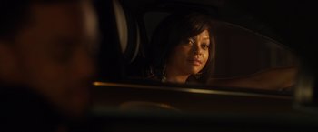 Movie still from “Think Like a Man” (2012), directed by Tim Story – A woman sitting in the back seat of a car looking into the mirror; Close Up shot, Over the shoulder angle