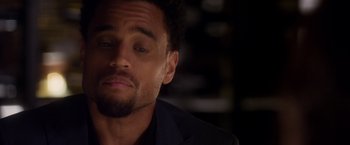 Movie still from “Think Like a Man” (2012), directed by Tim Story – A person wearing a suit; Close Up shot, Over the shoulder angle