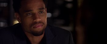 Movie still from “Think Like a Man” (2012), directed by Tim Story – A person wearing a suit; Close Up shot, Over the shoulder angle