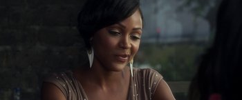 Movie still from “Think Like a Man” (2012), directed by Tim Story – A person with short black hair; Close Up shot, Over the shoulder angle