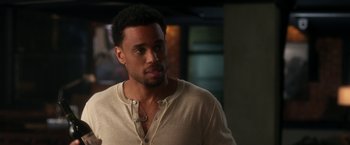 Movie still from “Think Like a Man” (2012), directed by Tim Story – A person wearing a shirt; Close Up shot, Over the shoulder angle