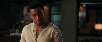 Movie still from “Think Like a Man” (2012), directed by Tim Story – A person wearing a shirt; Close Up shot, Over the shoulder angle