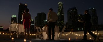 Movie still from “Think Like a Man” (2012), directed by Tim Story – A man standing in front of a dinner table; Extreme Wide shot, Low angle