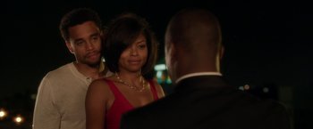 Movie still from “Think Like a Man” (2012), directed by Tim Story – A woman in a red dress is talking to a man in a black suit; Close Up shot, Over the shoulder angle