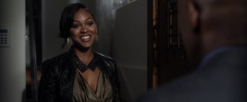 Movie still from “Think Like a Man” (2012), directed by Tim Story – A woman in a leather jacket smiling for the camera; Close Up shot, Over the shoulder angle