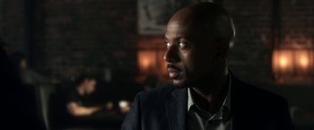 Movie still from “Think Like a Man” (2012), directed by Tim Story – A man in a suit looking to his left; Close Up shot, Over the shoulder angle