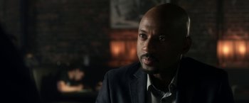 Movie still from “Think Like a Man” (2012), directed by Tim Story – A man in a suit is looking at the camera; Close Up shot, Over the shoulder angle