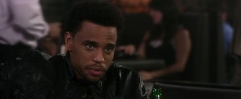 Movie still from “Think Like a Man” (2012), directed by Tim Story – A person wearing a leather jacket; Close Up shot, Over the shoulder angle