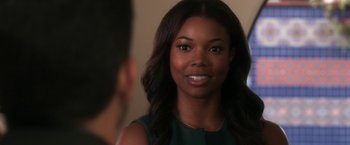 Movie still from “Think Like a Man” (2012), directed by Tim Story – A beautiful young woman with long black hair; Close Up shot, Over the shoulder angle