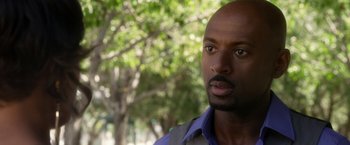 Movie still from “Think Like a Man” (2012), directed by Tim Story – A person wearing a blue shirt; Close Up shot, Over the shoulder angle