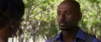 Movie still from “Think Like a Man” (2012), directed by Tim Story – A person wearing a blue shirt; Close Up shot, Over the shoulder angle