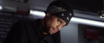 Movie still from “Think Like a Man” (2012), directed by Tim Story – A person wearing a bandanna; Close Up shot, Over the shoulder angle