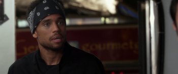 Movie still from “Think Like a Man” (2012), directed by Tim Story – A person wearing a hat; Close Up shot, Over the shoulder angle