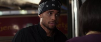 Movie still from “Think Like a Man” (2012), directed by Tim Story – A person wearing a head band; Close Up shot, Over the shoulder angle