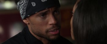 Movie still from “Think Like a Man” (2012), directed by Tim Story – A person wearing a hat; Close Up shot, Over the shoulder angle