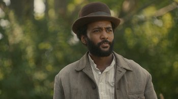 Movie still from “Anne with an E” (2017), created by Moira Walley-Beckett – A man with a beard wearing a hat and a jacket; Close Up shot, Over the shoulder angle