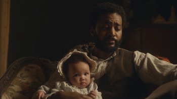 Movie still from “Anne with an E” (2017), created by Moira Walley-Beckett – A man holding a baby in his arms; Close Up shot, High angle