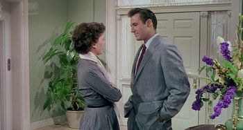 Movie still from “This Island Earth” (1955), directed by Joseph M. Newman – A man and a woman standing next to each other; Medium shot, Over the shoulder angle