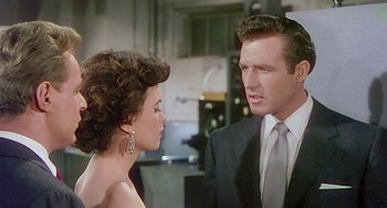 Movie still from “This Island Earth” (1955), directed by Joseph M. Newman – A man and a woman talking to each other; Close Up shot, Over the shoulder angle