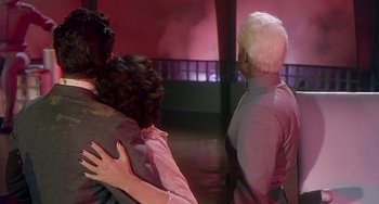 Movie still from “This Island Earth” (1955), directed by Joseph M. Newman – A group of people hugging in a room; Medium shot, Over the shoulder angle