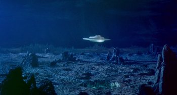 Movie still from “This Island Earth” (1955), directed by Joseph M. Newman – An image of an alien ship floating in the ocean; Extreme Wide shot, High angle