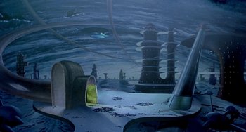 Movie still from “This Island Earth” (1955), directed by Joseph M. Newman – An image of a painting of an ocean and a tower; Extreme Wide shot, High angle