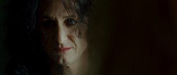 Movie still from “This Must Be the Place” (2011), directed by Paolo Sorrentino – A woman's face in the dark; Close Up shot, Over the shoulder angle