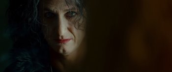 Movie still from “This Must Be the Place” (2011), directed by Paolo Sorrentino – A woman's face in the dark; Close Up shot, Over the shoulder angle