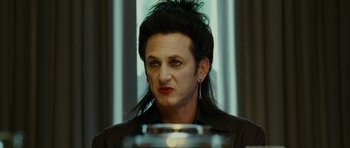 Movie still from “This Must Be the Place” (2011), directed by Paolo Sorrentino – A woman with a long black hair is looking at the camera; Close Up shot, Over the shoulder angle