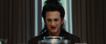 Movie still from “This Must Be the Place” (2011), directed by Paolo Sorrentino – A man with long black hair is looking at the camera; Close Up shot, Over the shoulder angle