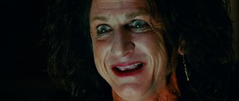Movie still from “This Must Be the Place” (2011), directed by Paolo Sorrentino – An older woman with a very big smile on her face; Extreme Close Up shot, Low angle