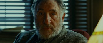 Movie still from “This Must Be the Place” (2011), directed by Paolo Sorrentino – An older man with a beard and a sweater; Close Up shot, Over the shoulder angle