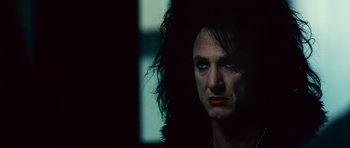 Movie still from “This Must Be the Place” (2011), directed by Paolo Sorrentino – A person with long black hair; Close Up shot, Low angle