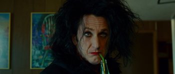 Movie still from “This Must Be the Place” (2011), directed by Paolo Sorrentino – A person holding a pipe in their mouth; Close Up shot, High angle
