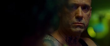 Movie still from “This Must Be the Place” (2011), directed by Paolo Sorrentino – A person with a tattoo on his face; Close Up shot, Over the shoulder angle